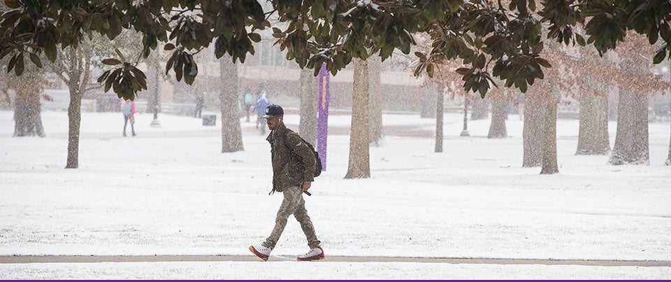 Students made their way to class on Feb. 24 as snow fell throughout the day, leading to cancellation of all classes after 3:30 p.m. (Photos by Cliff Hollis)