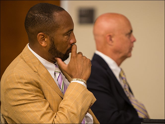 ECU Board of Trustees members Danny Scott, left, and Edwin Clark listen to discussion during the July 17 board meeting. At that meeting, ECU Provost Ron Mitchelson presented the plan for reorganization for ECU's College of Human Ecology. (Photo by Cliff Hollis)