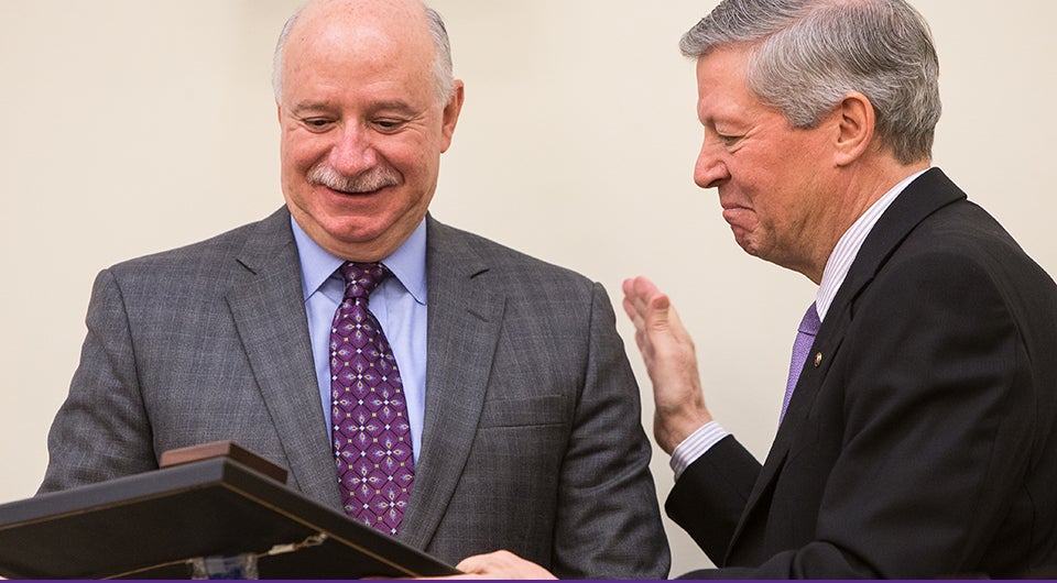 Chancellor Steve Ballard, right, recognizes outgoing board chairman Robert Brinkley during the April 24 meeting of the ECU Board of Trustees. Brinkley served on the board for eight years. (Photos by Cliff Hollis)