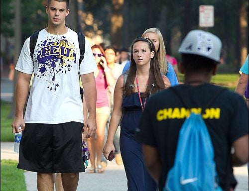 East Carolina University students walk to class on the first day of fall semester classes. Assessing the student learning that will take place throughout the semester is the focus of an upcoming forum on campus. (Photo by Cliff Hollis)