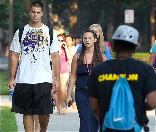 East Carolina University students walk to class on the first day of fall semester classes. Assessing the student learning that will take place throughout the semester is the focus of an upcoming forum on campus. (Photo by Cliff Hollis)