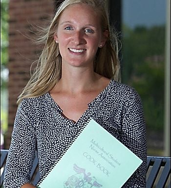 Blair Fuller, president of ECU's Multicultural Student Nursing Association, spearheaded the production of a cookbook that highlights cultural diversity within the College of Nursing. (Photos by Cliff Hollis)