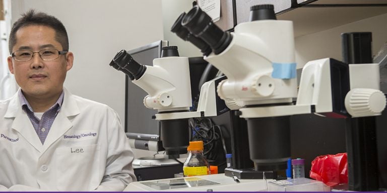 ECU hematology/oncology professor Dr. Myon-Hee Lee, pictured above, will apply private funding to acquire new data for his research on cancerous tumors and how they develop. (Photos by Cliff Hollis)