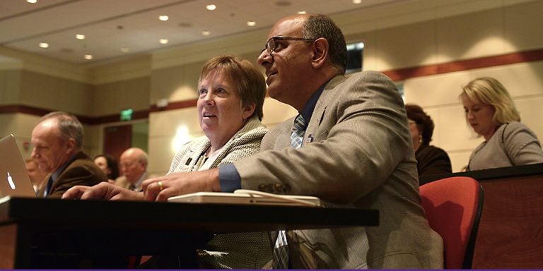 At the first Medical Education Day at ECU, Dr. Elizabeth Baxley, senior associate dean for academic affairs at the Brody School of Medicine, left, speaks with keynote speaker Dr. Rajesh Mangrulkar, associate dean for medical school education at the University of Michigan. ECU and the University of Michigan are among 11 schools selected nationwide to reshape medical education. (Photos by Gretchen Baugh)