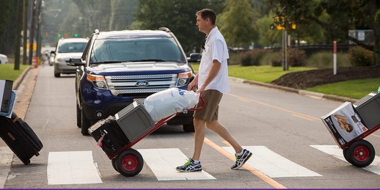 Incoming East Carolina University students and their families pushed carts and lugged boxes across campus Aug. 19 on the first day of residence hall move-in for the fall semester. (Photos by Cliff Hollis)