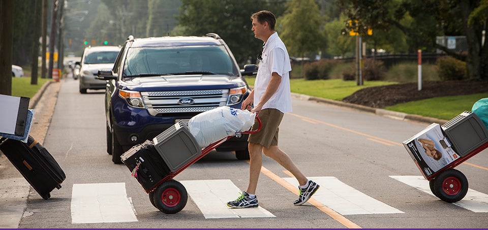 Incoming East Carolina University students and their families pushed carts and lugged boxes across campus Aug. 19 on the first day of residence hall move-in for the fall semester. (Photos by Cliff Hollis)