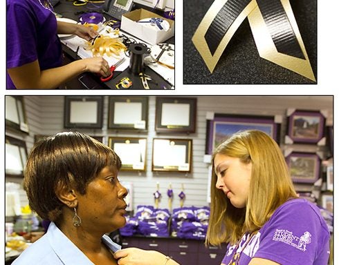 CHRIS MURPHY REMEMBERED: Employees at the Dowdy Student Store at East Carolina University handed out ribbons July 11 in memory of ECU employee Chris Murphy, who was killed in an weekend accident. Murphy was assistant director at ECU's Office of Undergraduate Admissions. Pictured above, Hillary Bunch pins a ribbon for Ann Taft in Housekeeping, who knew Murphy from working in the same building. In the upper left, Jeannette Williams prepares ribbons for distribution. (Photos by Cliff Hollis)