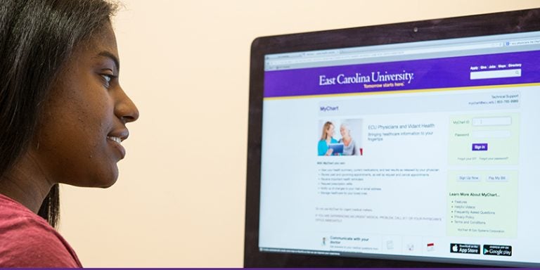 ECU Physicians’ online patient portal, MyChart, allows individuals like ECU student Summer Tillman, pictured above using the MyChart web site, to access their health care team electronically. (Photo by Cliff Hollis)