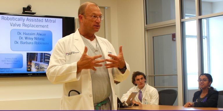 Dr. Wiley Nifong makes opening remarks before Honors College students Zachary Elliott and Aenia Amin present case studies as part of their summer internship at the East Carolina Heart Institute. (Photos by Jessica Nottingham)