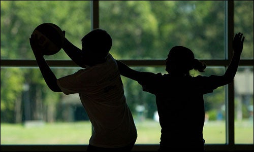 Campers enjoy a game of basketball at the Take Off 4-Health healthy lifestyle camp, a program that works to instill healthy habits for overweight youth. (Photos by Cliff Hollis)