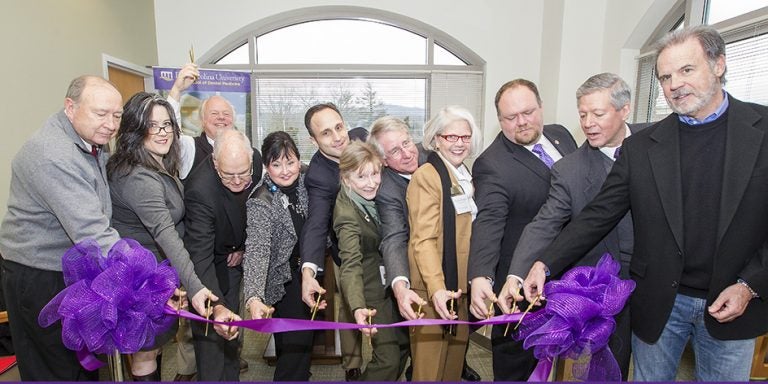 Moved inside due to inclement weather, the ribbon cutting ceremony for ECU's seventh dental community service learning center was held in Spruce Pine Jan. 30. The center will improve access to oral health care for the underserved region situated in the Blue Ridge mountains of North Carolina. (Photos by Jay Clark)