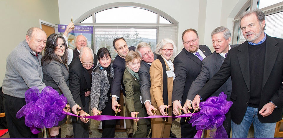 Moved inside due to inclement weather, the ribbon cutting ceremony for ECU's seventh dental community service learning center was held in Spruce Pine Jan. 30. The center will improve access to oral health care for the underserved region situated in the Blue Ridge mountains of North Carolina. (Photos by Jay Clark)