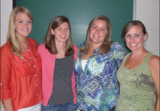 ECU elementary education graduate students who initiated the flat mascot exchange with Rollins College are, left to right, Beth Laughridge, Laura Wetherington, Sylvia Dieu and Stephanie Burress. (Photo by Kendra Alexander)