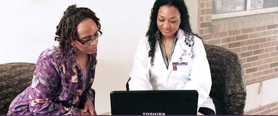 Nursing professor Dr. Pamela Reis, left, and nurse-midwifery student Farrah Forney review information about a virtual patient online. The virtual patient is being used in a plan of treatment that includes faculty and students from multiple disciplines at ECU. (Photos courtesy of Pamela Reis)