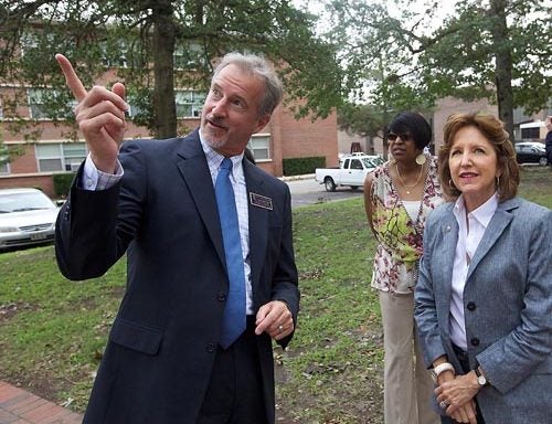 Senator Kay Hagan toured East Carolina University Tuesday, Aug. 30 to inspect the damage from Hurricane Irene. Images show Hagan touring with ECU Chief of Staff Philip Rogers, studying ceiling damage in Spilman and observing damage pointed out by Bill McCartney where a tree fell near Greene Residence Hall. McCartney is assistant vice chancellor for Campus Living and Dining. Also shown are Deborah Harris, sweeping debris near the Bate Building and Facilities Services employees working to repair damages on campus. (Photos by Cliff Hollis)