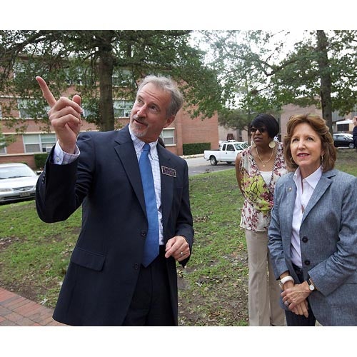 Senator Kay Hagan toured East Carolina University Tuesday, Aug. 30 to inspect the damage from Hurricane Irene. Images show Hagan touring with ECU Chief of Staff Philip Rogers, studying ceiling damage in Spilman and observing damage pointed out by Bill McCartney where a tree fell near Greene Residence Hall. McCartney is assistant vice chancellor for Campus Living and Dining. Also shown are Deborah Harris, sweeping debris near the Bate Building and Facilities Services employees working to repair damages on campus. (Photos by Cliff Hollis)