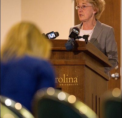 ECU Provost Marilyn Sheerer addresses members of media during a press conference held May 19 to announce ECU's acceptance of NCAA penalties for self-reported academic fraud violations. She said ECU responded quickly and took decisive action as soon as the violations became apparent. (Photo by Cliff Hollis)