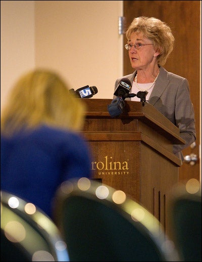 ECU Provost Marilyn Sheerer addresses members of media during a press conference held May 19 to announce ECU's acceptance of NCAA penalties for self-reported academic fraud violations. She said ECU responded quickly and took decisive action as soon as the violations became apparent. (Photo by Cliff Hollis)