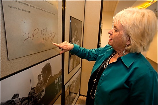 Balinda Ferree recognizes her father's handwriting on historic teletype she and husband John donated to Joyner Library. The original teletype outlines the events surrounding the Kennedy assassination on Nov. 22, 1963. More photos from the event are posted below. (Photos by Cliff Hollis)