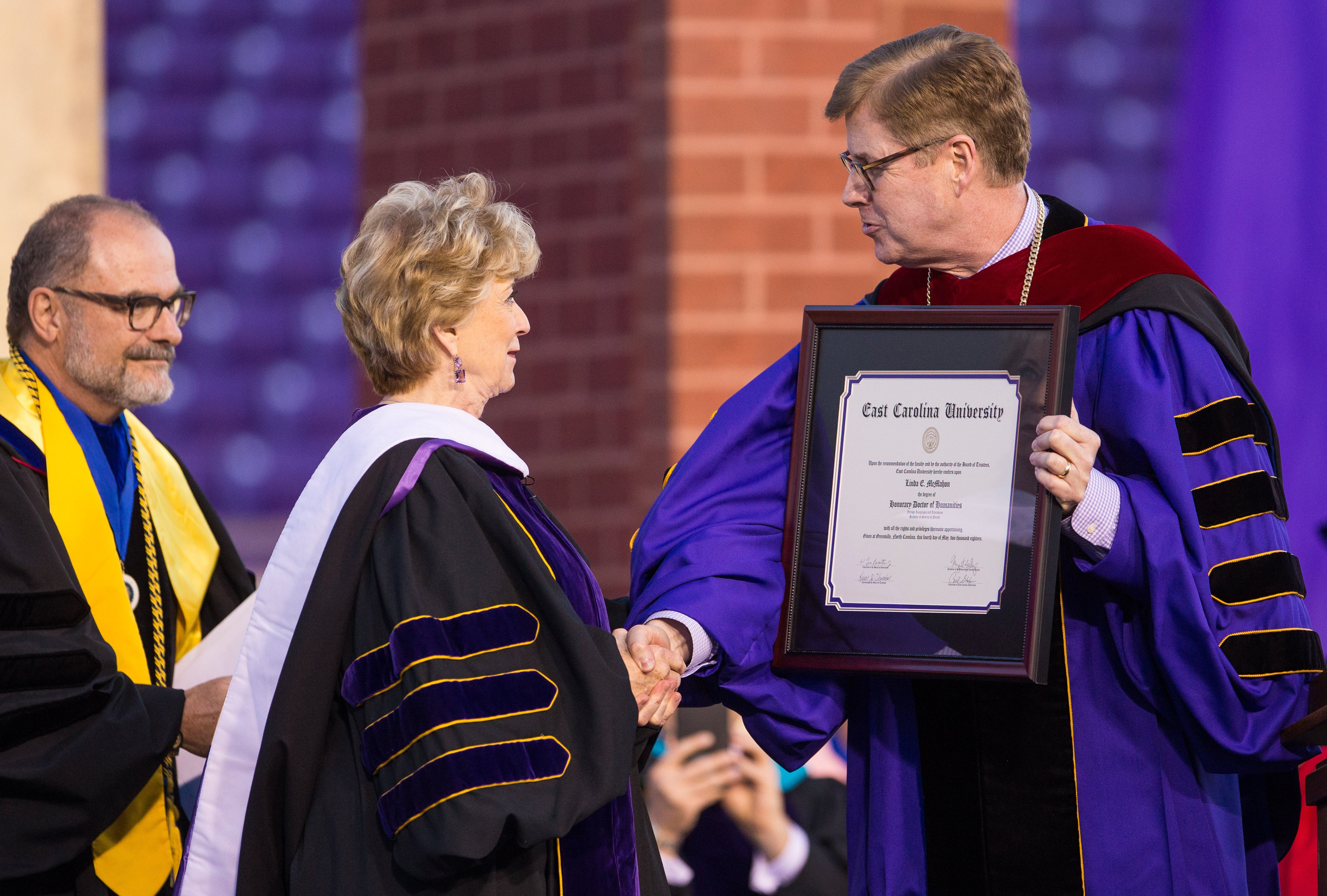 Chancellor Cecil Staton honors Linda McMahon with a honorary doctor of humanities degree.