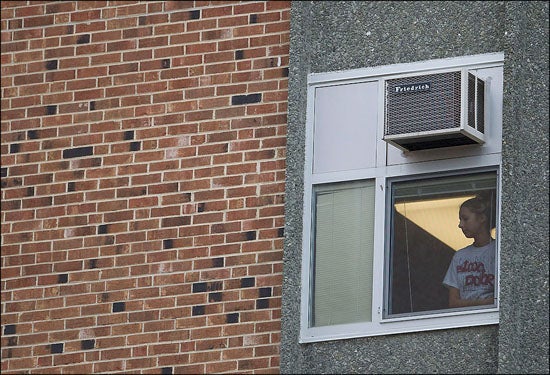 An ECU student peers out a Clement Hall window during a Nov. 16 campus lockdown triggered by reports of an armed individual. Officials have released a report that examines how well lockdown procedures were handled. (Photo by Cliff Hollis)