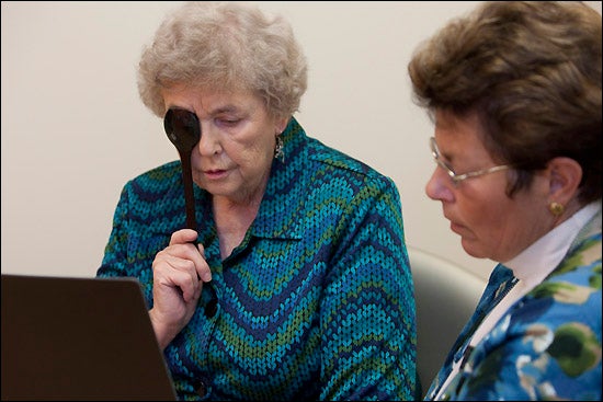 At right, Dr. Jane Painter, ECU professor and occupational therapist, checks Marjorie Everett’s vision during ECU's Fall Risk Assessment Clinic. (Photos by Cliff Hollis)