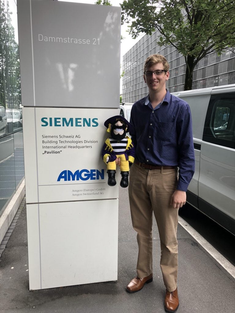 Timothy Hartman poses with PeeDee outside Siemens.