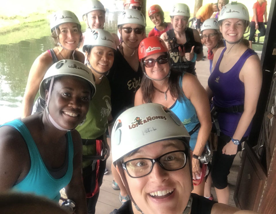 The students gear up for a zip-lining adventure. 