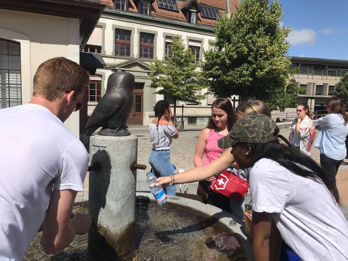 Symone and the group fill up at a fountain.
