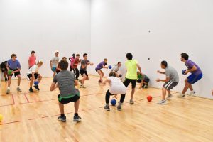 group of teens playing dodgeball