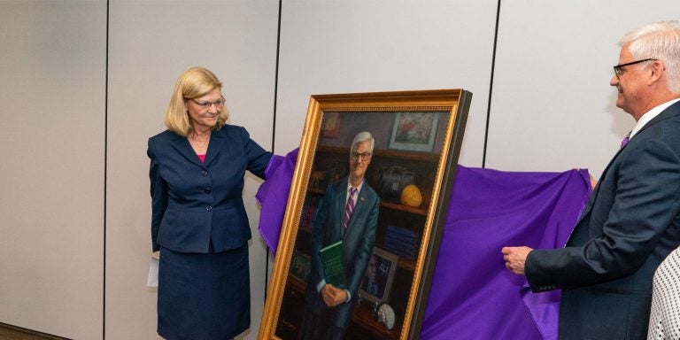 Unveiling a portrait of Dr. Mark Stacy