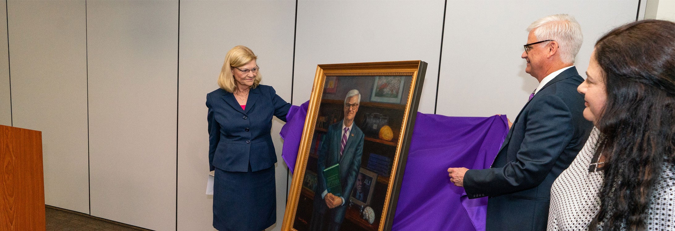 Unveiling a portrait of Dr. Mark Stacy