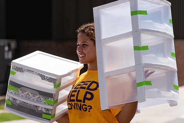 Volunteers wearing bright gold shirts helped students move in across campus on Aug. 15. 
