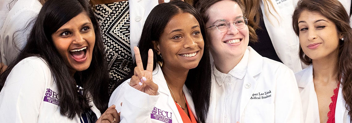 Brody School of Medicine Class of 2022 medical students celebrate after the annual White Coat Ceremony. (ECU Photo by Rhett Butler)