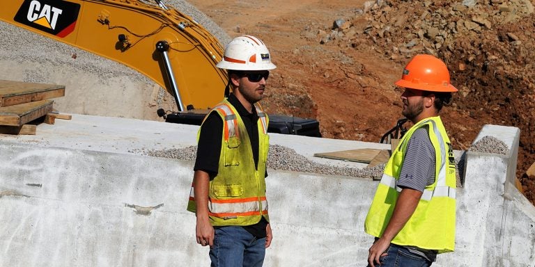 Twins Matthew, left, and Andrew Guillot, seniors in ECU’s construction management program, interned this summer.