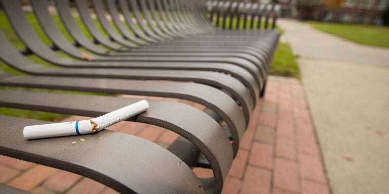 broken cigarette on a campus bench