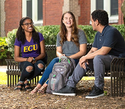 Students sitting on a bench 