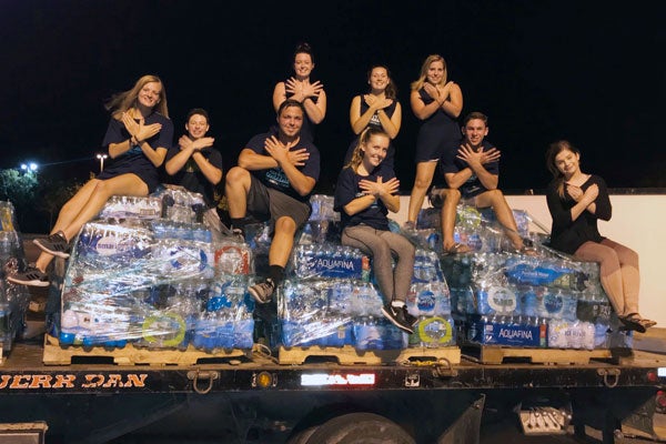 A group of college students, including ECU freshman Michael Hinson, collect water bottles for Hurricane Florence relief efforts. (Photo contributed by Michael Hinson)