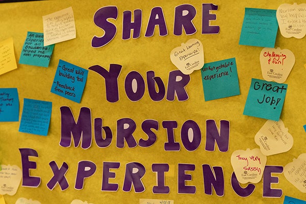 Messages written by participants fill a bulletin board in the Mursion lab in the College of Education. 