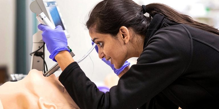 Third-year med student Noopur Doshi practices airway management in the Interprofessional Clinical Simulation Center.