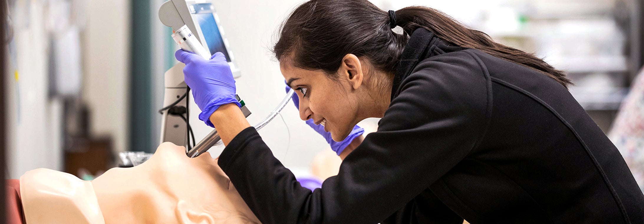 Third-year med student Noopur Doshi practices airway management in the Interprofessional Clinical Simulation Center.