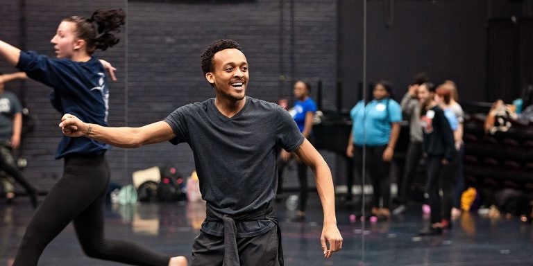 Donterreo Culp, an ECU senior majoring in dance performance, works with high school students in Messick Theatre.