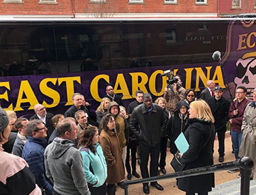 ECU researchers gather around New Bern Alderman Sabrina Bengel (center) during a walking tour of the city. New Bern received significant damage from Hurricane Florence last fall.