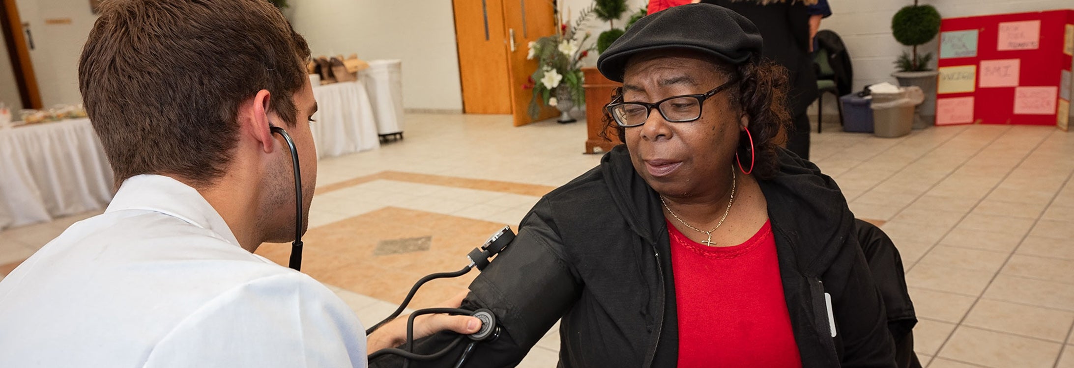 Gloria Savage gets her blood pressure checked during the Jean Mills Health Symposium on Feb. 22.