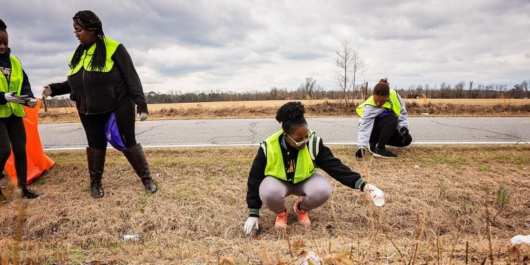 Students pick up trash along Old River Road northwest of Greenville. (Photos by Cliff Hollis)