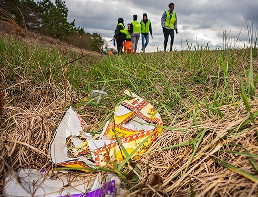 Food bags, bottles, cigarette butts and other litter lined the road awaiting cleanup by ECU students participating in the Alternative Break Experience on March 4.