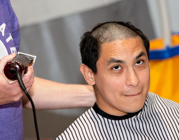 Participants helped to raise more than $52,000 to fight pediatric cancer by shaving their heads and cutting their hair. 