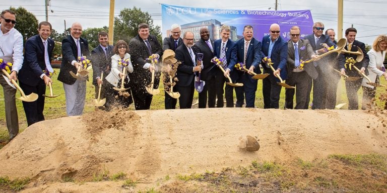 ECU officials and representatives from the design and construction firms responsible for the Life Sciences and Biotechnology Building break ground on the $90 million project. (Photos by Cliff Hollis)