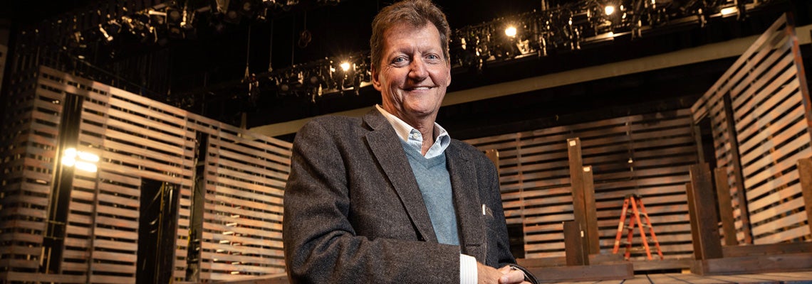 ECU alumnus and Tony winner Howell Binkley stands next to the McGinnis Theatre stage on Nov. 8.