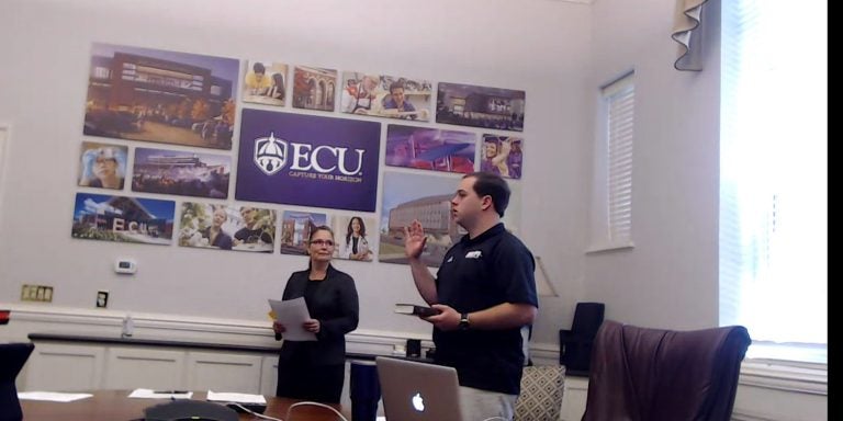 Scott Shook (left), Tucker Robbins (right) and Van Isley (inset) were sworn iin as members of the ECU Board of Trustees by Kimberly Nicholson, university program specialist for the Office of University Counsel, during a virtual meeting Tuesday.